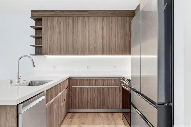 a kitchen with a sink and cabinets