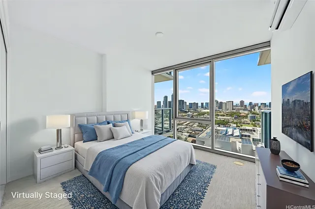 a bedroom with a large bed and a large window
