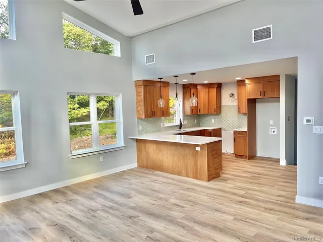 a large kitchen with stainless steel appliances granite countertop a stove and a sink