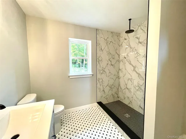 a bathroom with a bathtub and shower