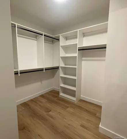 a view of an empty walk in closet