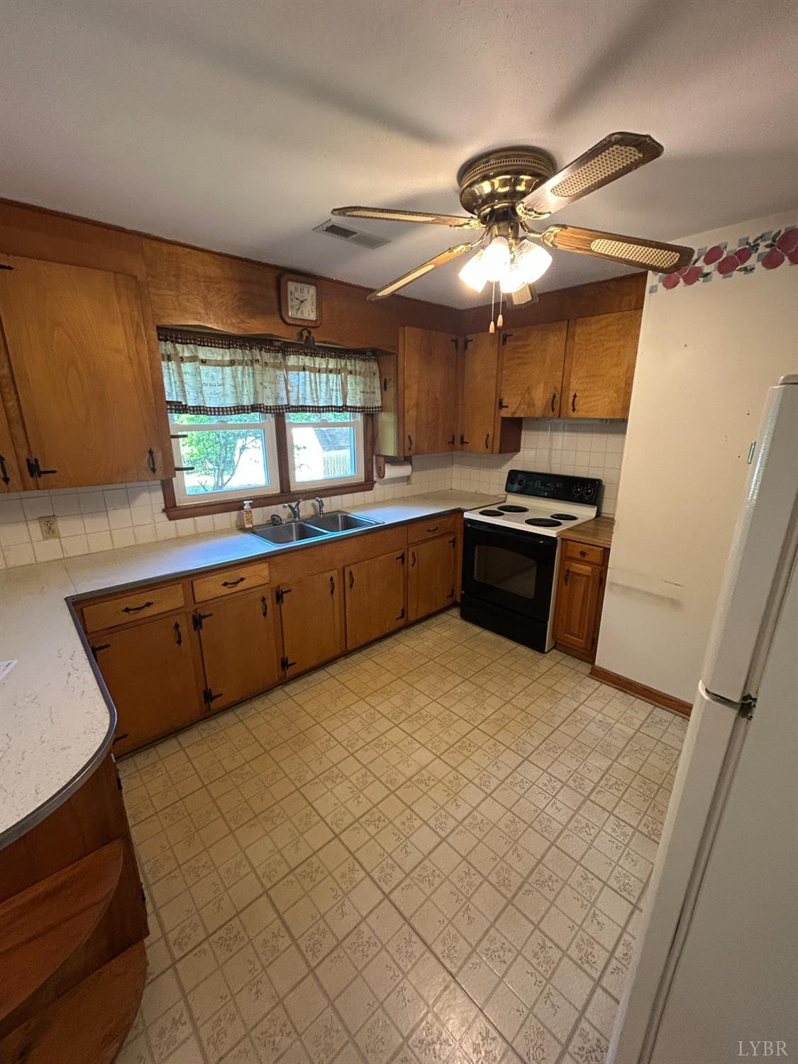 465 Wileman Road Lynch Station, VA 24571 - Photo 10 of 45 a large kitchen with a large window appliances and cabinets