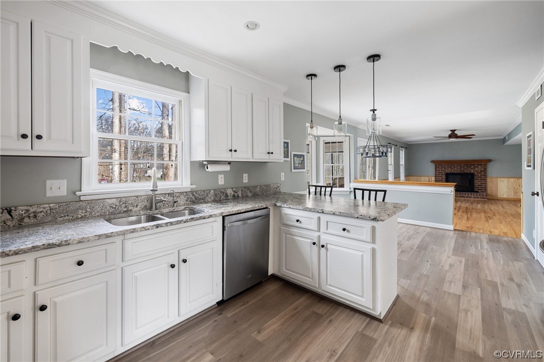 13809 Shadow Ridge Road Midlothian, VA 23112 - Photo 12 of 36 a kitchen with stainless steel appliances granite countertop a sink a stove and cabinets with wooden floor