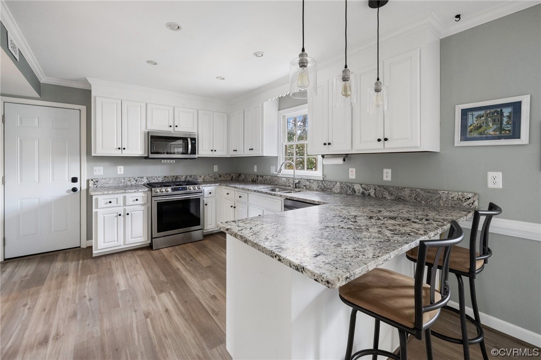 13809 Shadow Ridge Road Midlothian, VA 23112 - Photo 13 of 36 a kitchen with stainless steel appliances granite countertop a stove top oven a sink dishwasher and a refrigerator with white cabinets