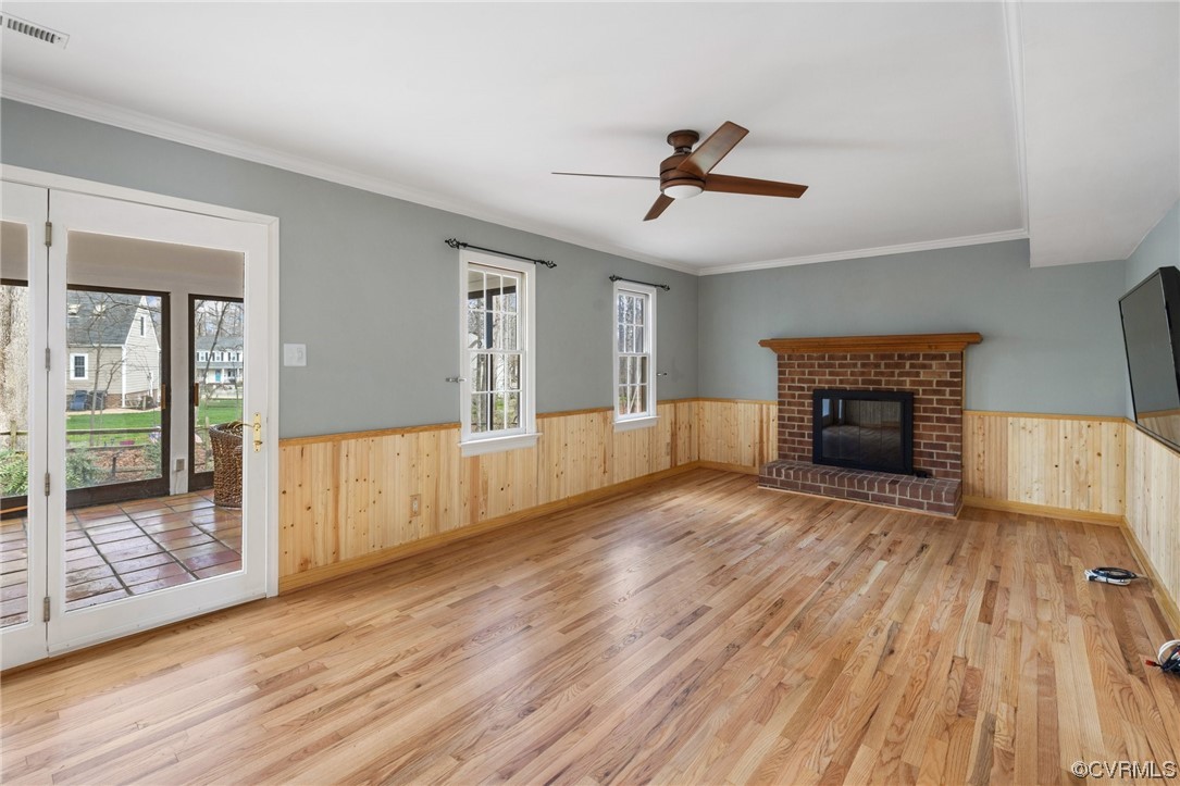 13809 Shadow Ridge Road Midlothian, VA 23112 - Photo 18 of 36 a view of empty room with wooden floor and fireplace