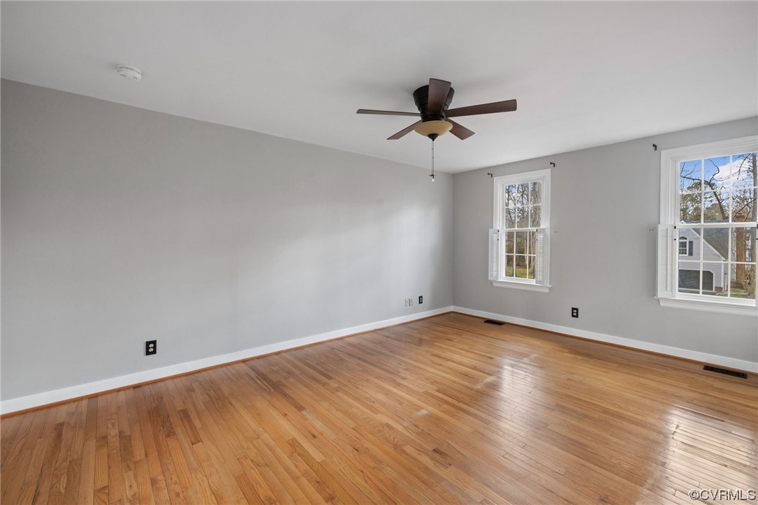 13809 Shadow Ridge Road Midlothian, VA 23112 - Photo 23 of 36 a view of empty room with wooden floor and fan
