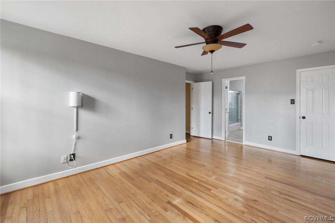 13809 Shadow Ridge Road Midlothian, VA 23112 - Photo 24 of 36 a view of empty room with wooden floor and ceiling fan
