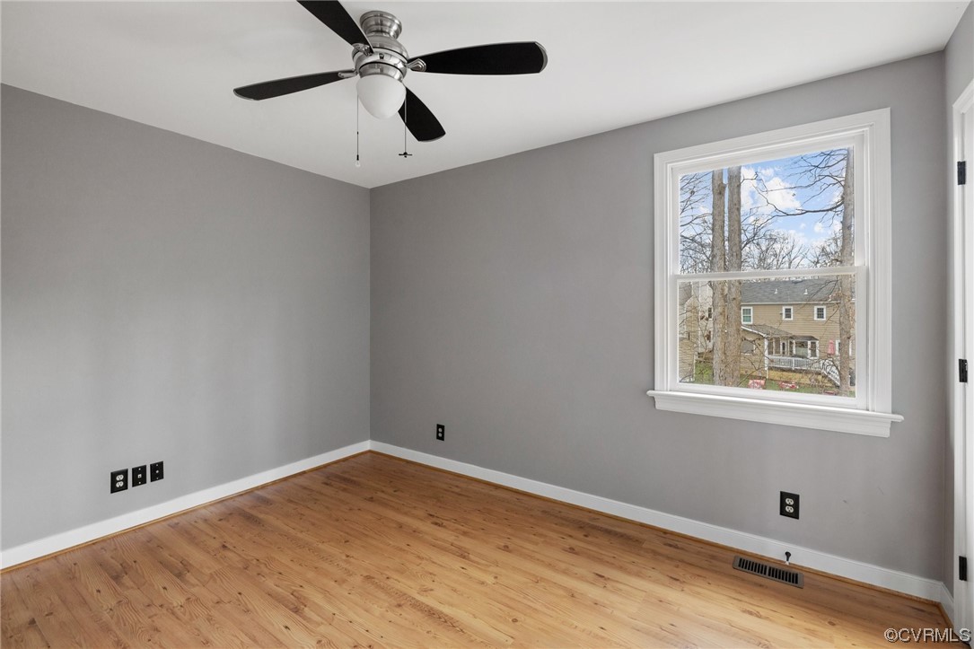 13809 Shadow Ridge Road Midlothian, VA 23112 - Photo 29 of 36 a view of empty room with wooden floor and fan