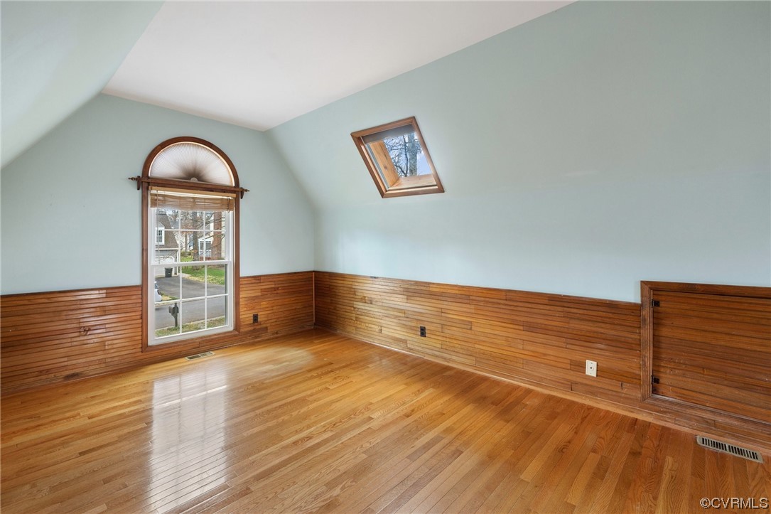 13809 Shadow Ridge Road Midlothian, VA 23112 - Photo 31 of 36 a view of an empty room with wooden floor and a window