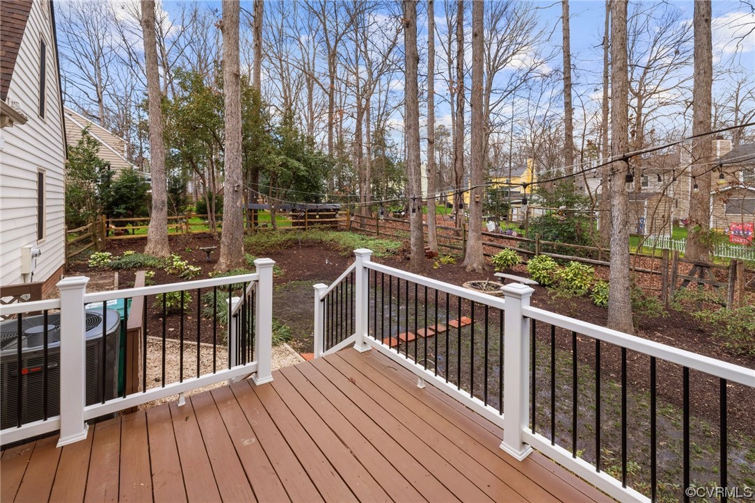 13809 Shadow Ridge Road Midlothian, VA 23112 - Photo 33 of 36 a view of a balcony with wooden floor and fence