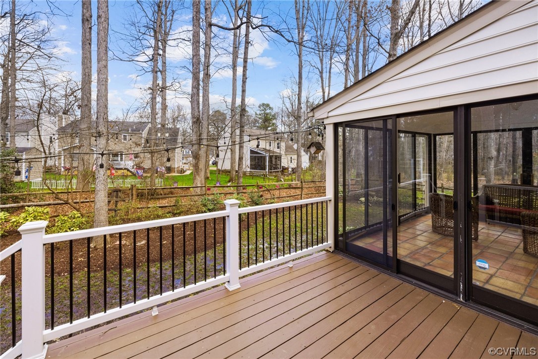 13809 Shadow Ridge Road Midlothian, VA 23112 - Photo 34 of 36 a view of a balcony with wooden floor next to a yard