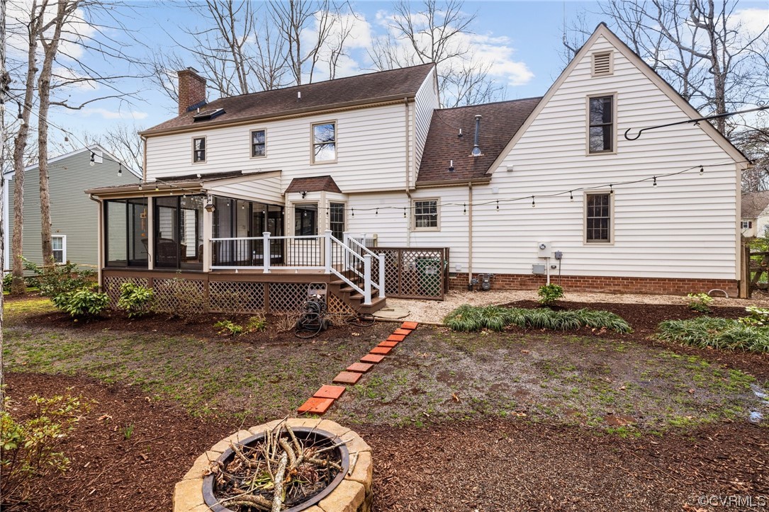 13809 Shadow Ridge Road Midlothian, VA 23112 - Photo 35 of 36 a view of a white house next to a yard with potted plants