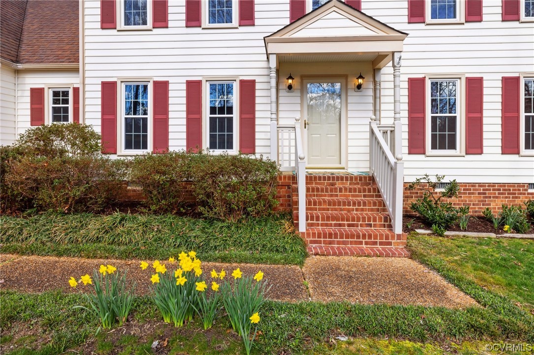 13809 Shadow Ridge Road Midlothian, VA 23112 - Photo 4 of 36 a front view of a house with garden