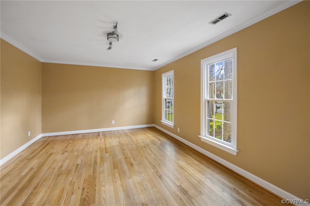 13809 Shadow Ridge Road Midlothian, VA 23112 - Photo 5 of 36 a view of an empty room with wooden floor and a window