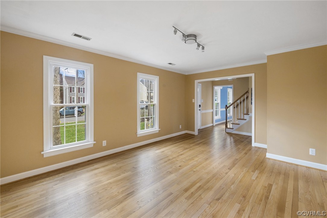 13809 Shadow Ridge Road Midlothian, VA 23112 - Photo 6 of 36 a view of an empty room with a window and wooden floor