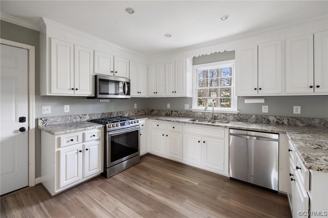 13809 Shadow Ridge Road Midlothian, VA 23112 - Photo 10 of 36 a white kitchen with granite countertop stainless steel appliances