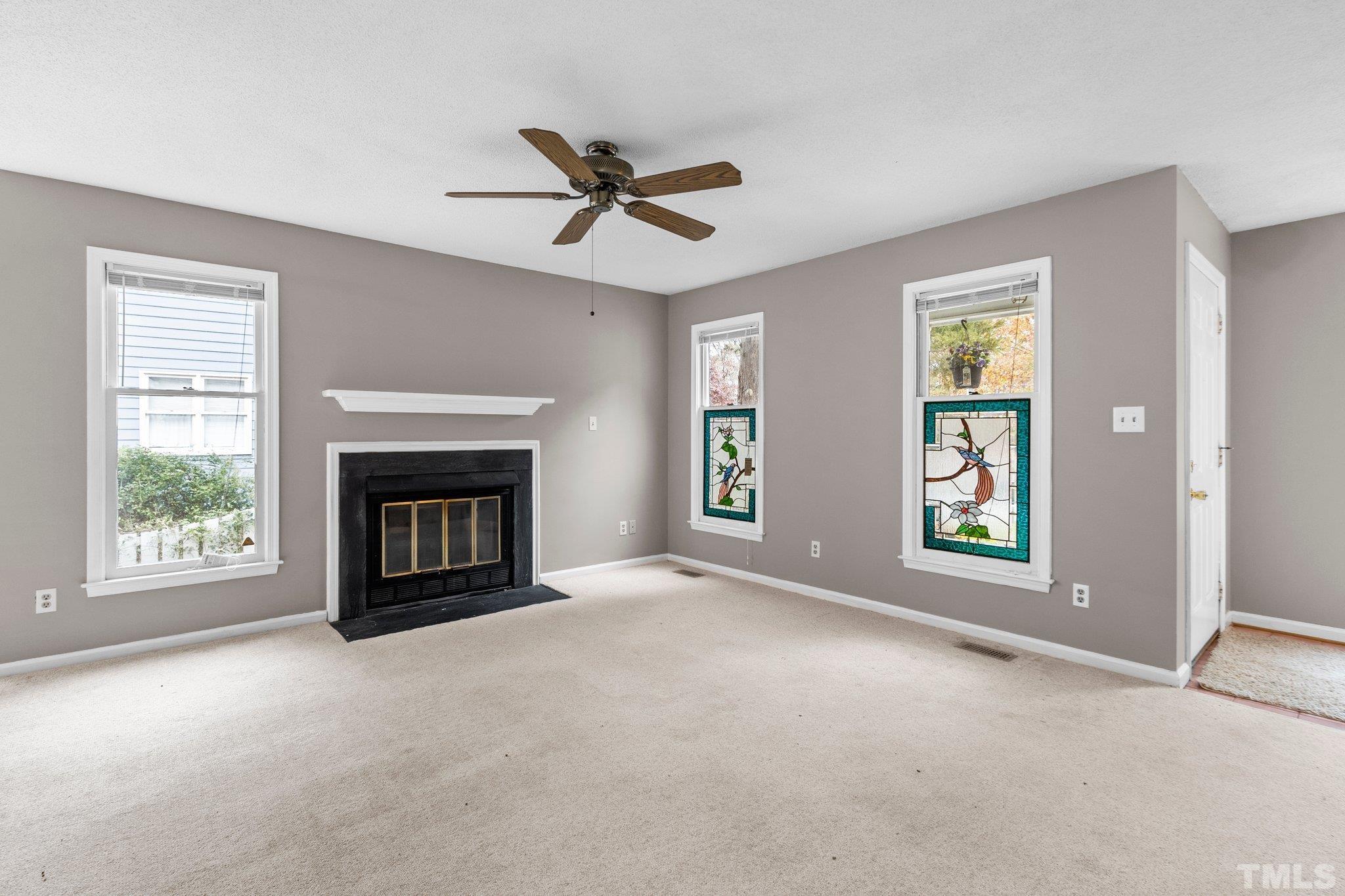 1305 Logan Street Durham, NC 27704 - Photo 16 of 32 a view of an empty room with window and fire place