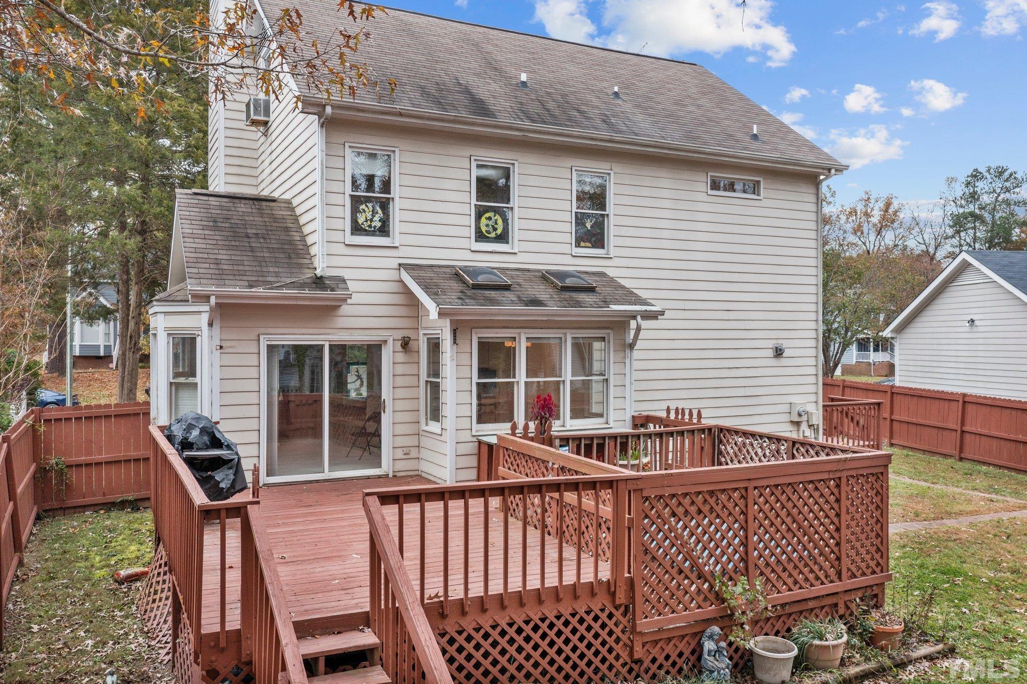 1305 Logan Street Durham, NC 27704 - Photo 25 of 32 a view of a house with a wooden deck and furniture
