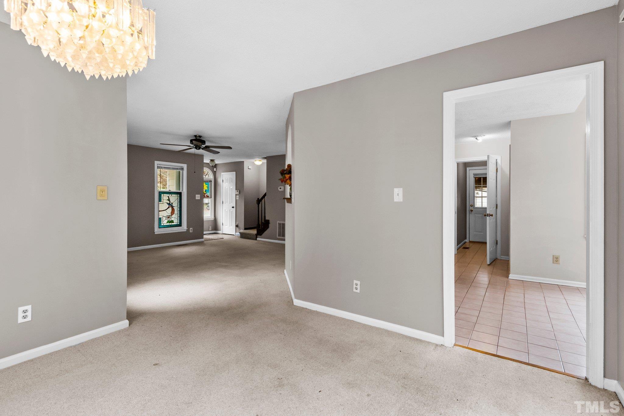 1305 Logan Street Durham, NC 27704 - Photo 4 of 32 an empty room with windows and entrance