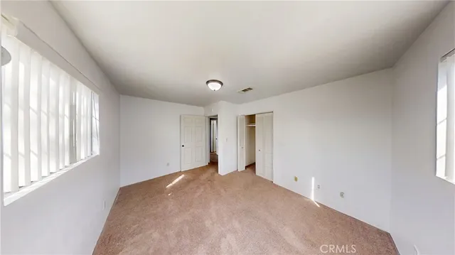 an empty room with windows