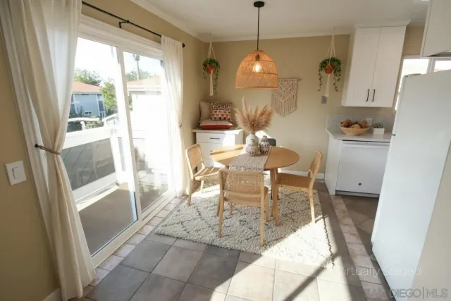 a dining room with furniture and window