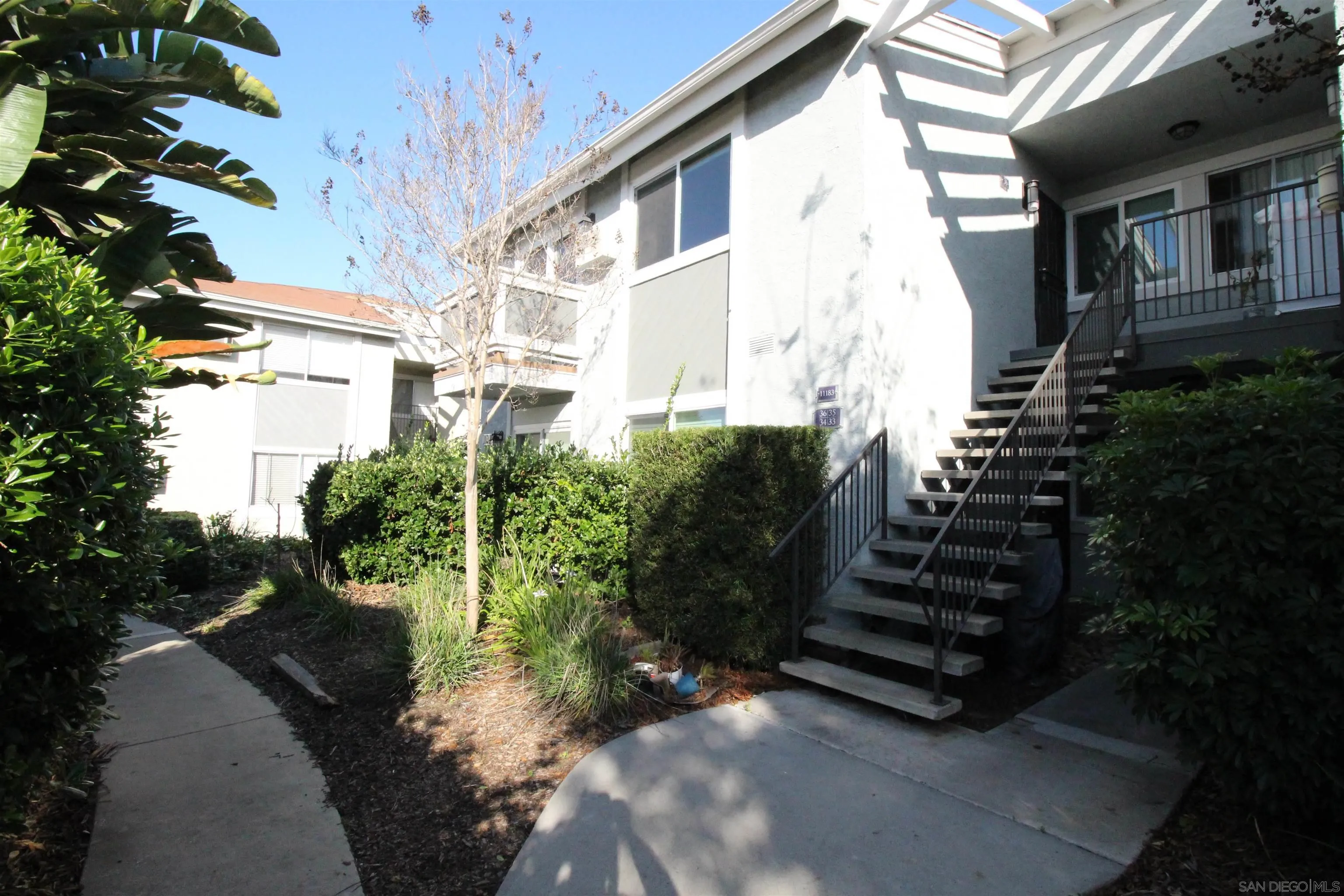 11183 Kelowna Road, Unit 36 San Diego, CA 92126 - Photo 15 of 19 a view of a house with a yard