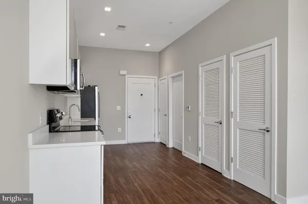 a view of a storage & utility room with wooden floor