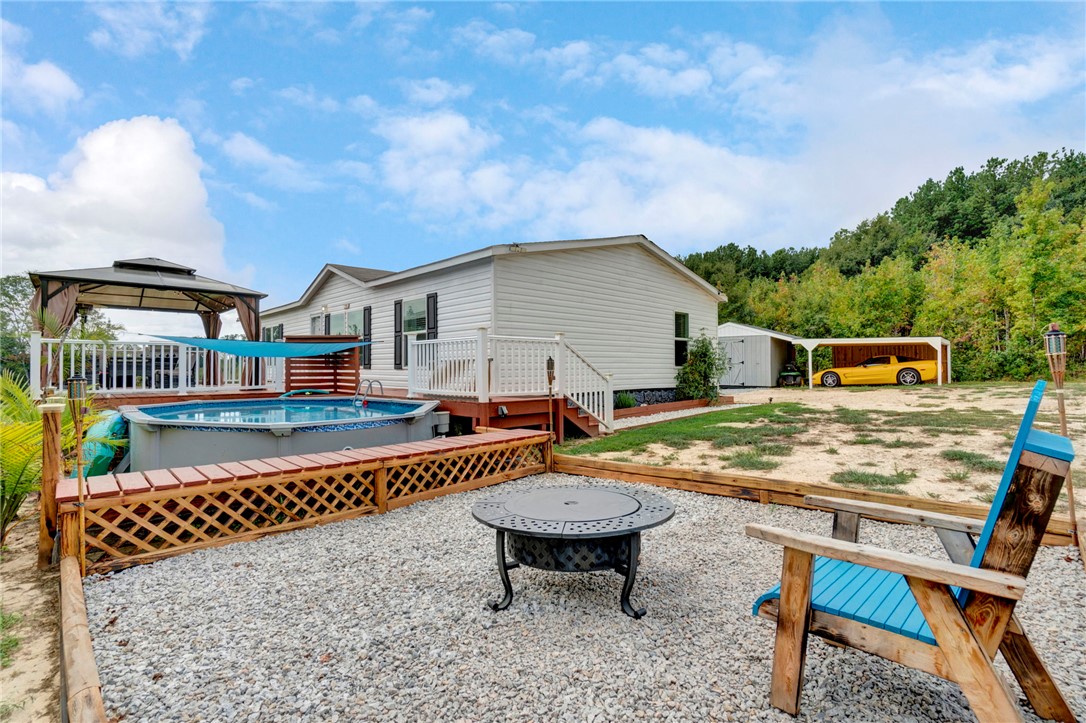 2655 State Rd S-4-108 Anderson, SC 29624 - Photo 27 of 37 An inviting backyard retreat features gravel ground cover alongside an above-ground pool.