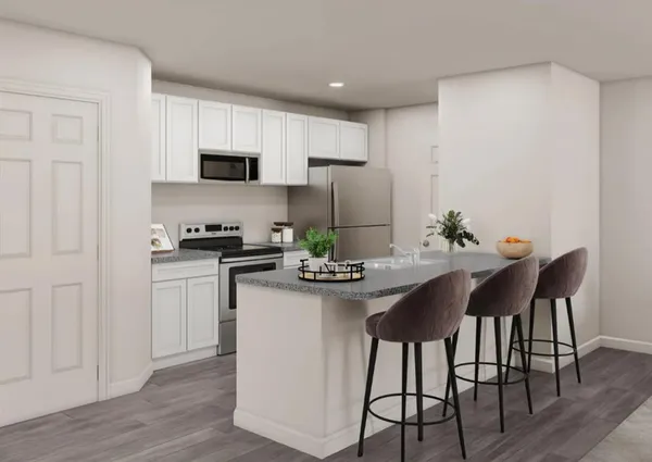 a living room with furniture a wooden floor and a flat screen tv