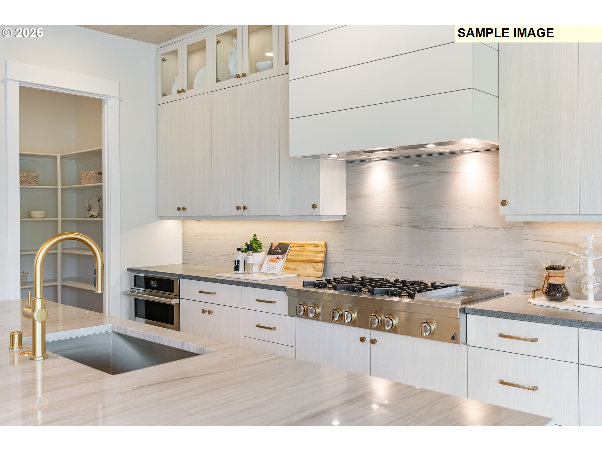 1509 South Creekview Place, Unit L6 Ridgefield, WA 98642 - Photo 12 of 44 a kitchen with granite countertop a stove a sink and a microwave