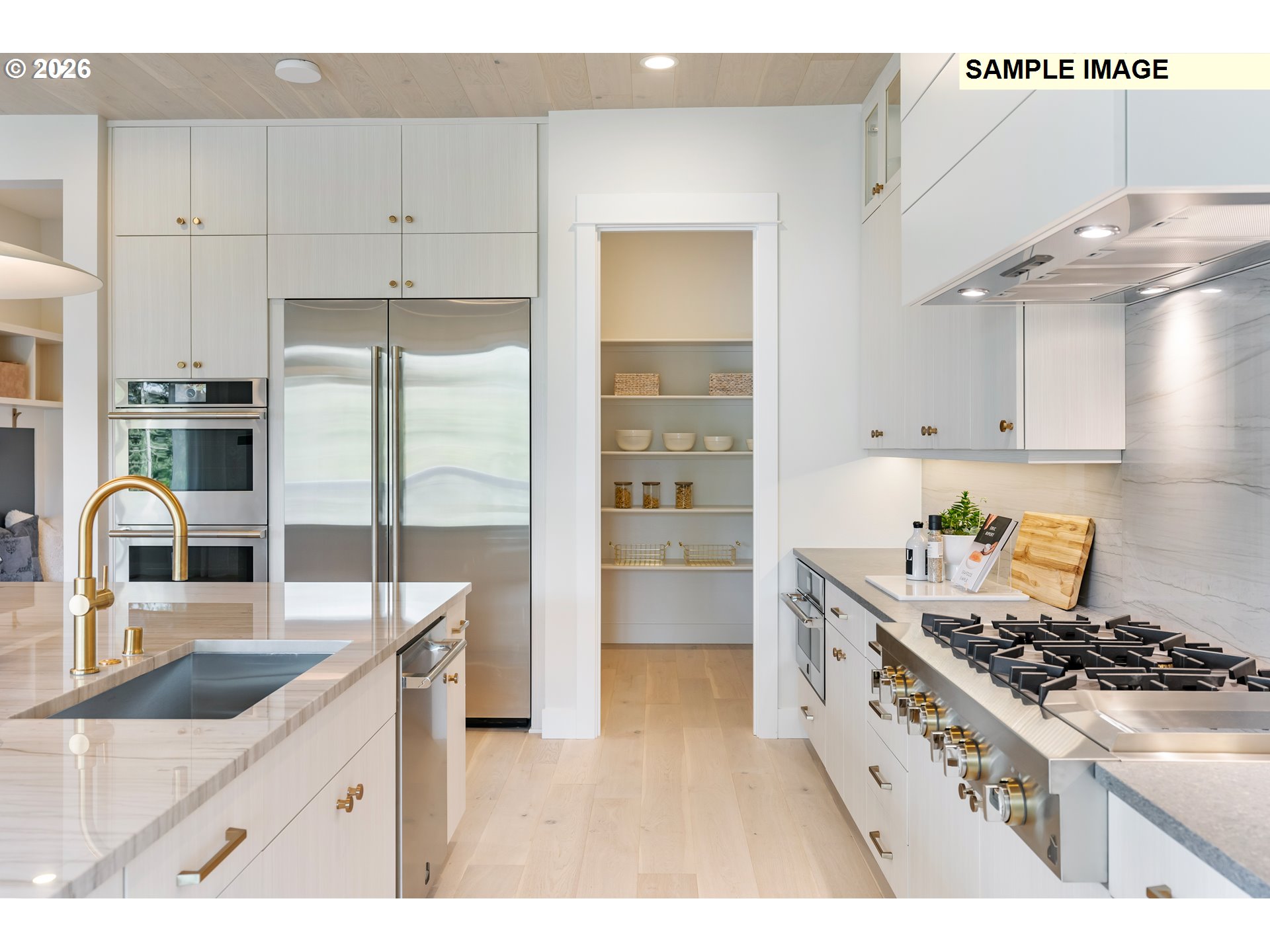 1509 South Creekview Place, Unit L6 Ridgefield, WA 98642 - Photo 13 of 44 a kitchen with granite countertop a sink stainless steel appliances and white cabinets