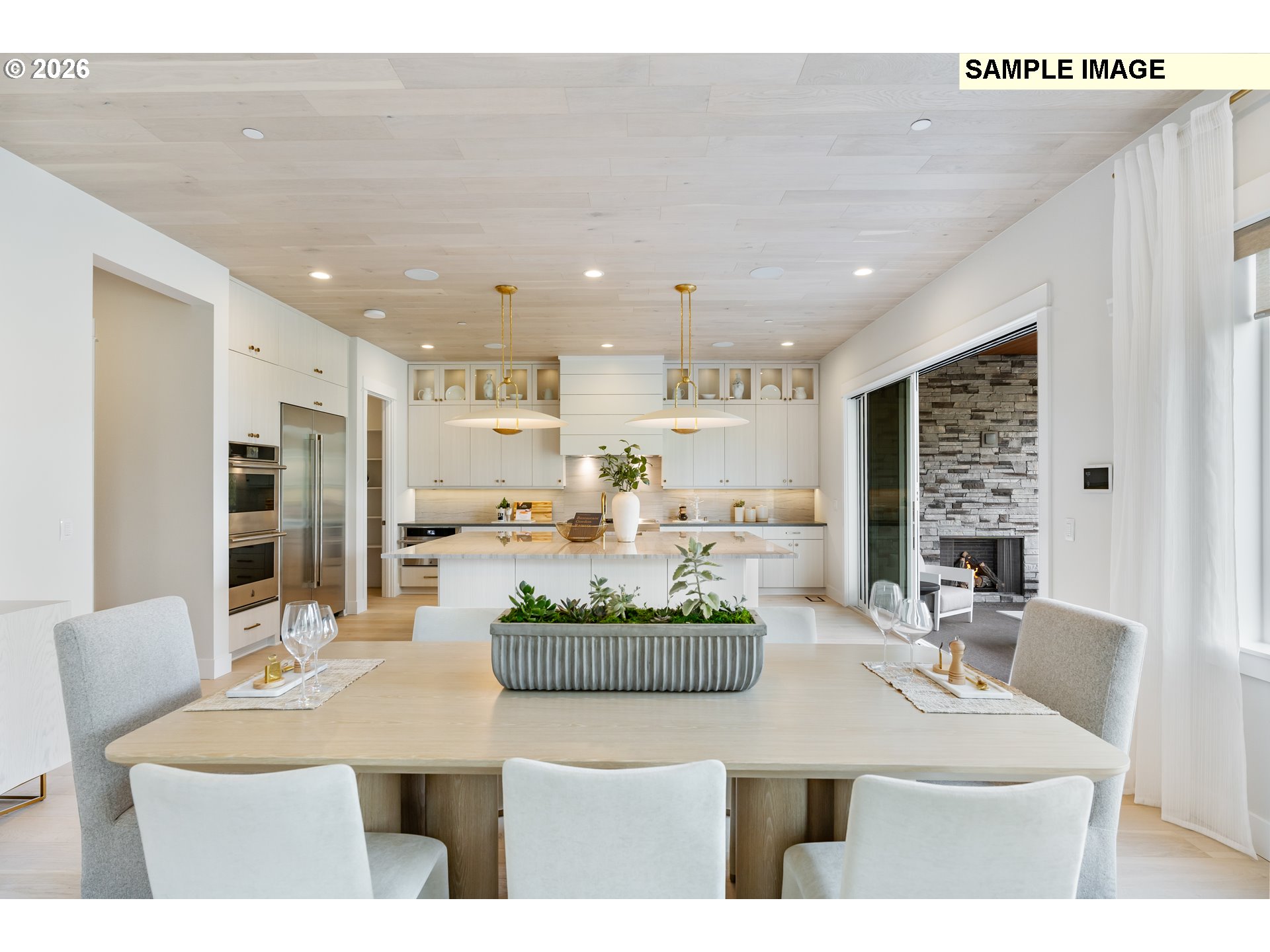 1509 South Creekview Place, Unit L6 Ridgefield, WA 98642 - Photo 14 of 44 a dining room with furniture a large window and kitchen view