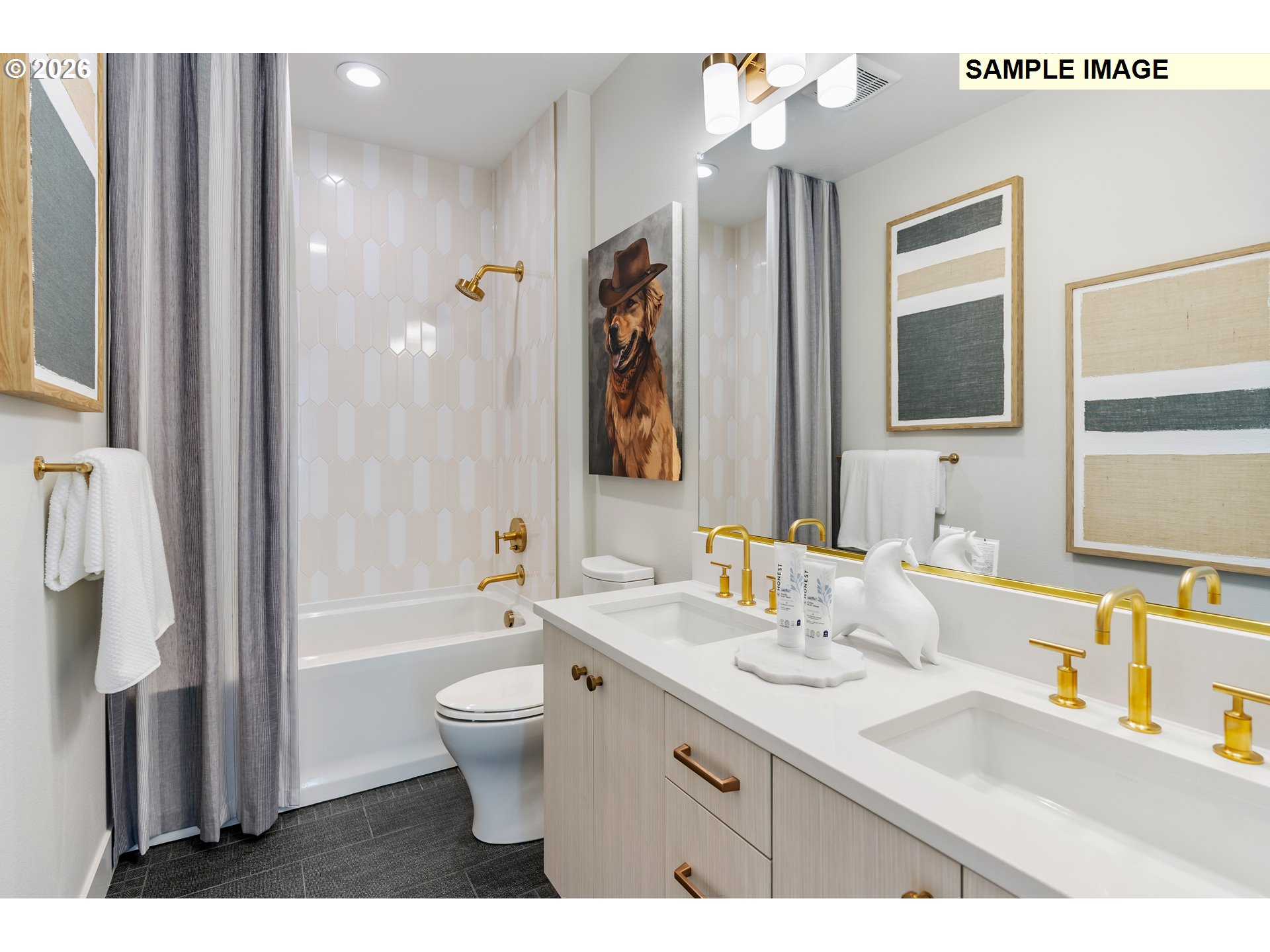 1509 South Creekview Place, Unit L6 Ridgefield, WA 98642 - Photo 31 of 44 a bathroom with a double vanity sink toilet mirror and bathtub