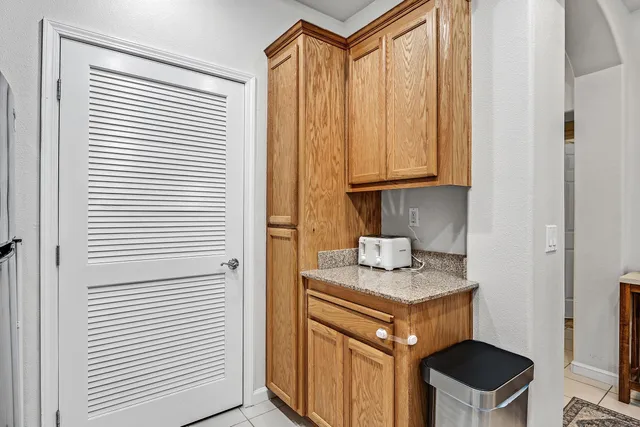 a kitchen with a window a sink and a cabinets