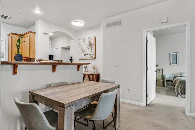 a kitchen with a table and chairs in it
