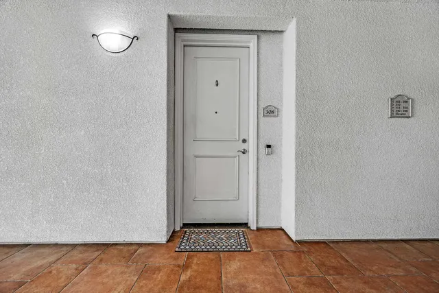 a view of an empty room and wooden floor