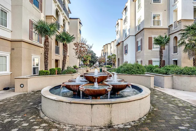 a view of a tall building with swimming pool