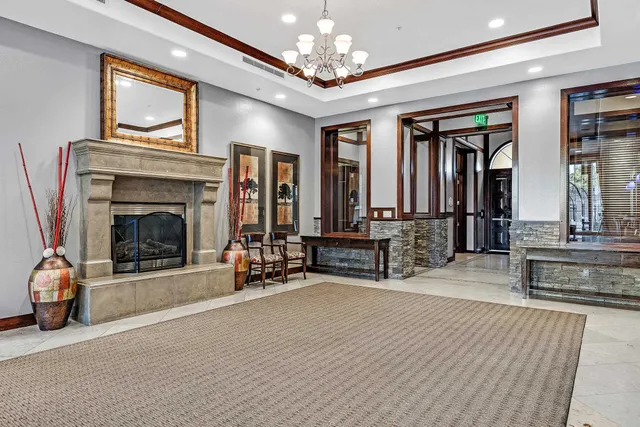 a kitchen with stainless steel appliances granite countertop a refrigerator stove and sink