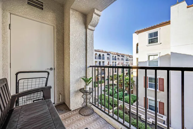 a view of a balcony with chair