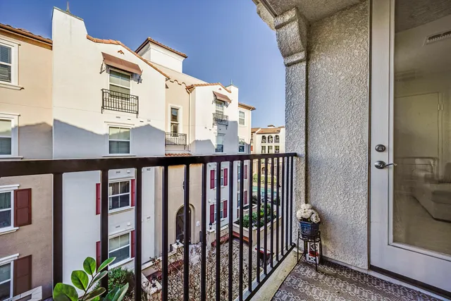 a view of balcony with a small yard