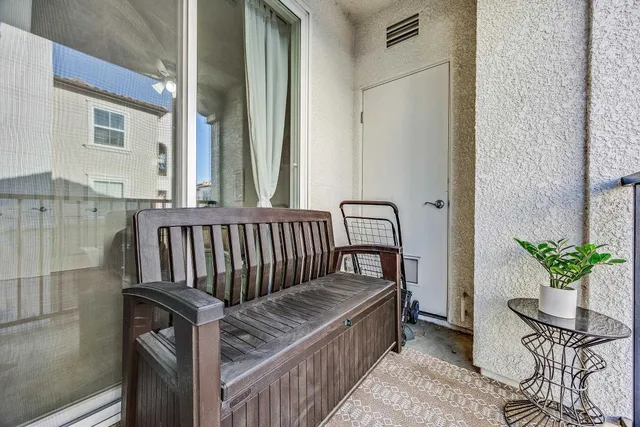 a view of a balcony with wooden floor