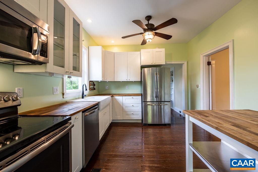 727 Tilman Road Charlottesville, VA 22901 - Photo 13 of 41 a kitchen with stainless steel appliances a refrigerator a stove a sink and a refrigerator