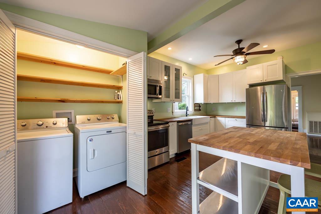 727 Tilman Road Charlottesville, VA 22901 - Photo 14 of 41 a kitchen with a stove a sink and a refrigerator