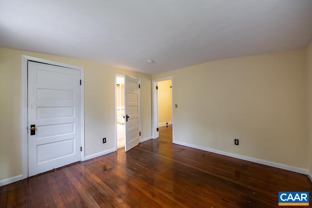 727 Tilman Road Charlottesville, VA 22901 - Photo 16 of 41 a view of an empty room with wooden floor