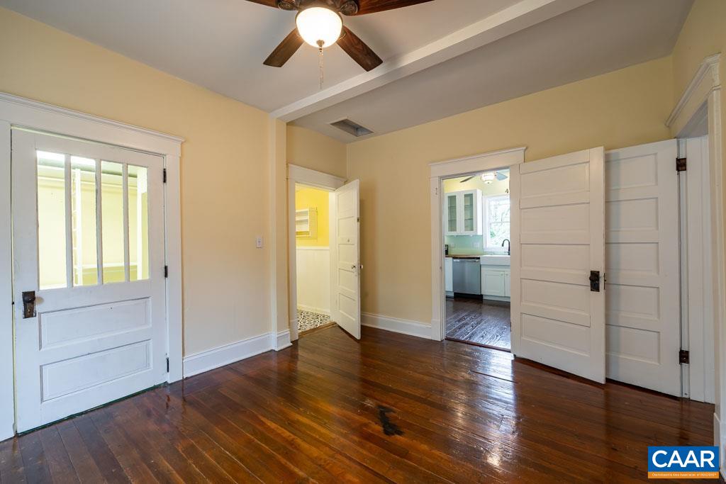 727 Tilman Road Charlottesville, VA 22901 - Photo 22 of 41 wooden floor in an empty room with a window