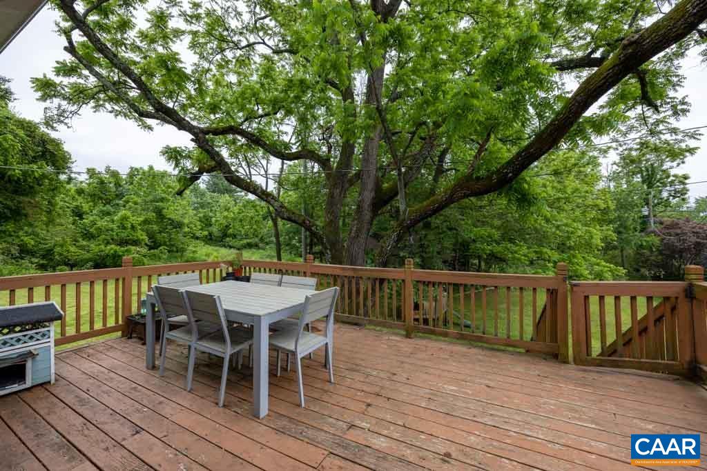 727 Tilman Road Charlottesville, VA 22901 - Photo 25 of 41 a view of a deck with furniture and trees around