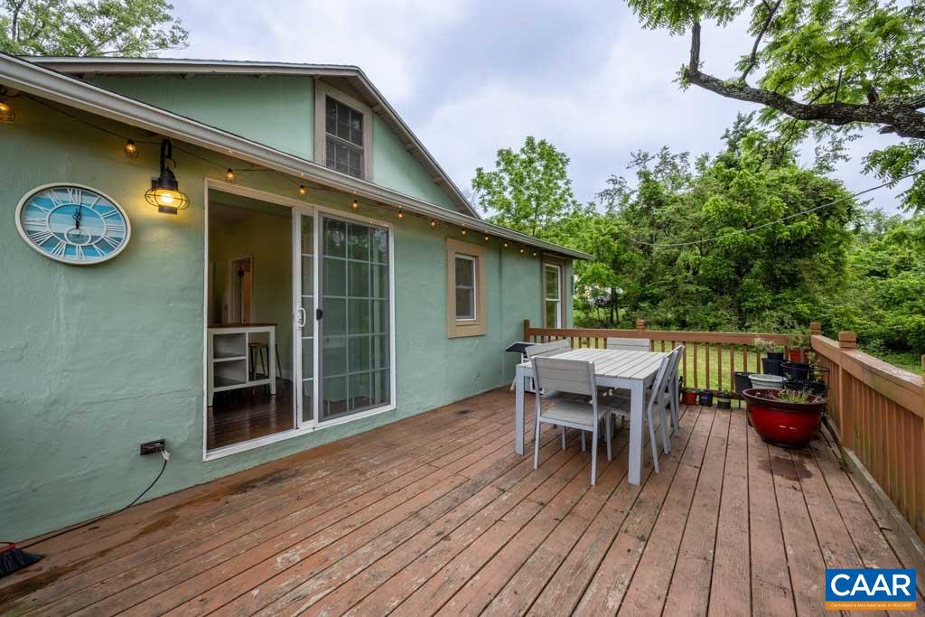 727 Tilman Road Charlottesville, VA 22901 - Photo 26 of 41 a balcony with wooden floor table and chairs