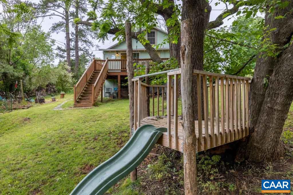 727 Tilman Road Charlottesville, VA 22901 - Photo 32 of 41 a view of a backyard with couches plants and large trees