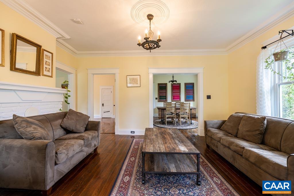 727 Tilman Road Charlottesville, VA 22901 - Photo 5 of 41 a living room with furniture and a chandelier