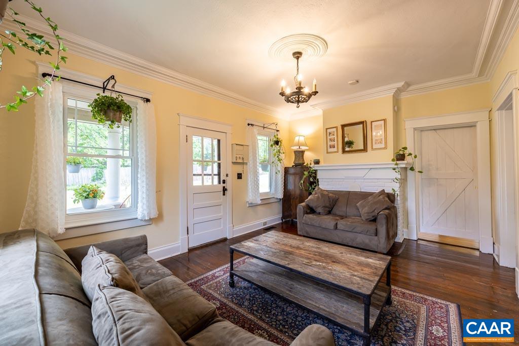 727 Tilman Road Charlottesville, VA 22901 - Photo 7 of 41 a living room with furniture and a fireplace